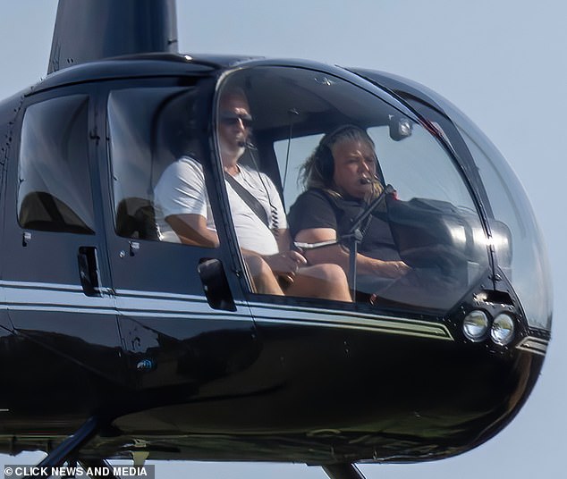 Pictured: Hollywood seen previously in his helicopter. He stayed with his brother for two days before jetting back south, with a quick pit stop for fuel in Stoke-on-Trent