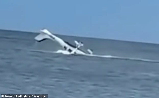 Dramatic footage showed the rescue of a pilot from a plane crash near Oak Island Pier in North Carolina after an emergency water landing on August 2 went horribly wrong