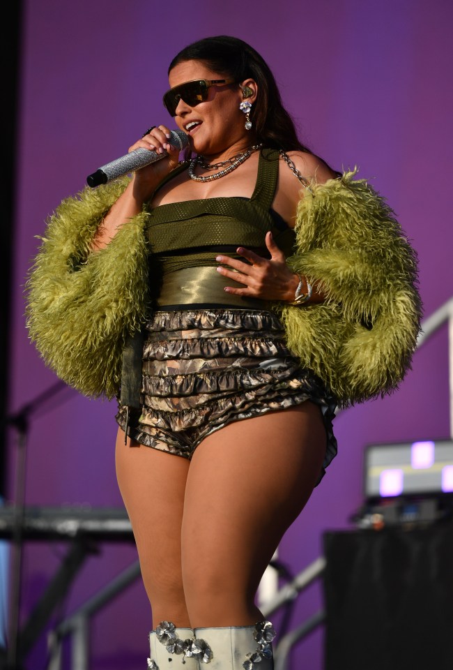 Nelly Furtado performing on stage at a music festival.