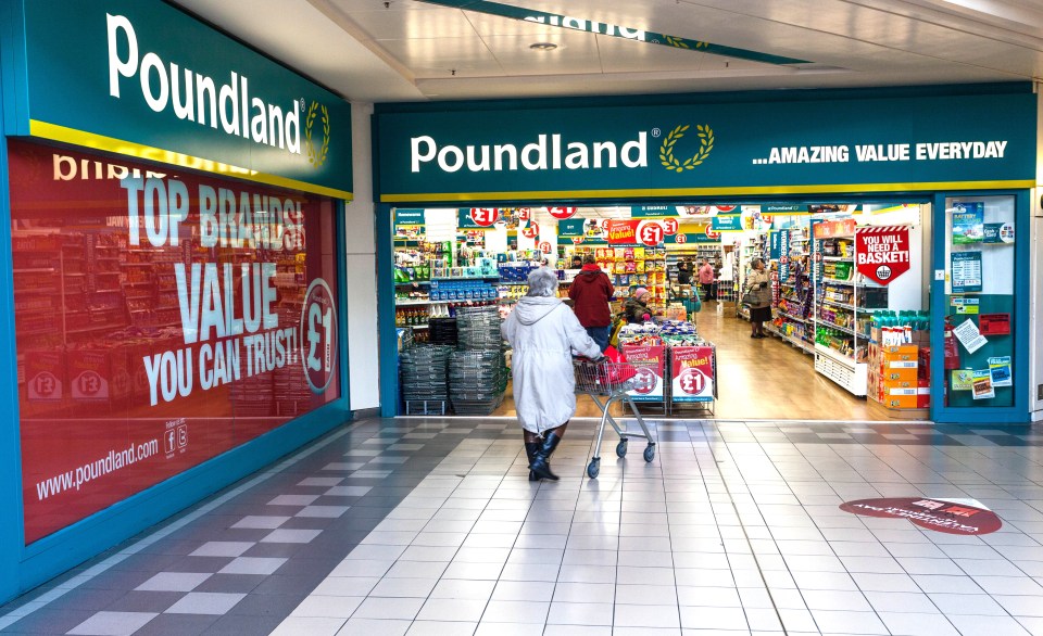 Senior woman entering a Poundland store.