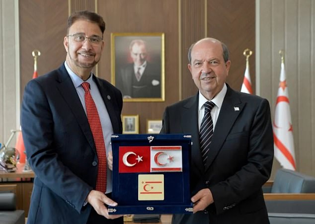 The official Cypriot government condemned the 'unacceptable' trip by Labour's Afzal Khan (left), piling pressure on Sir Keir Starmer to sack him Above, the Labour MP with the Turkish Cypriot leader Ersin Tatar (right)