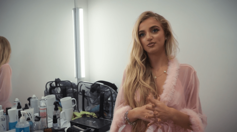 Princess Andre in a pink robe.