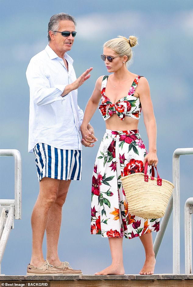 Lady Kitty Spencer put on a stunning display in a floral ensemble as she holidayed with her husband Michael Lewis (pictured together) and mother in Saint Tropez