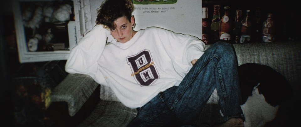 Photo of Amy Bradley sitting on a couch.