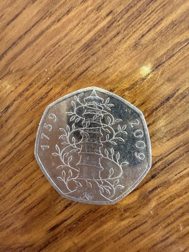 2009 fifty pence coin featuring a pagoda entwined with vines.