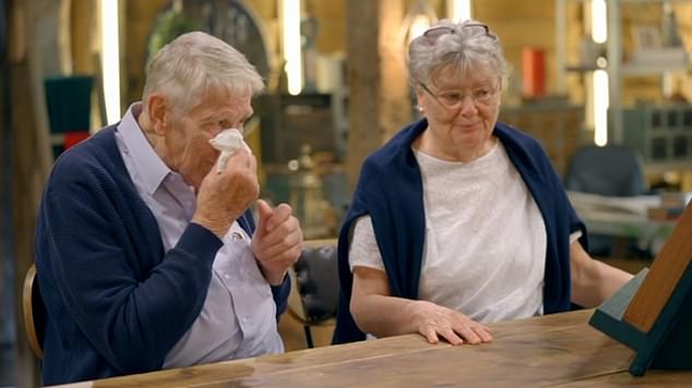 The couple, who are in their seventies, wept after a specialist team were able to restore the message and frame it as a lasting tribute to Chris