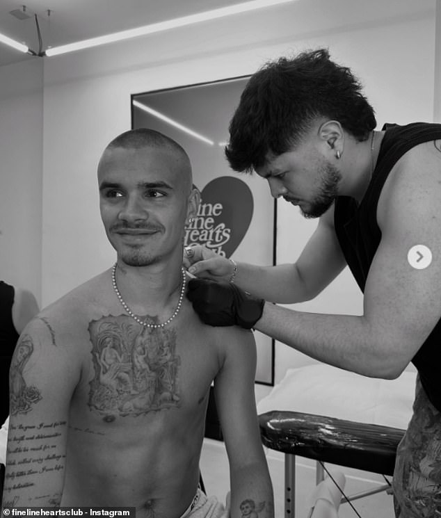 Romeo Beckham has revealed his new poignant tattoo as he appeared to take another dig at Brooklyn amid their bitter family feud