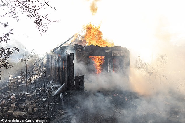 A house burns after being hit by Russian shelling in Kostiantynivka, Donetsk region, Ukraine, on August 16, 2025