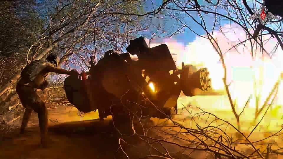 Russian soldier firing a gun near the Ukrainian border.