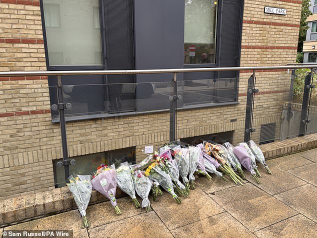 Floral tributes left outside a building in Mill Park, near Cambridge train station, on the road where 20-year-old student Mohammed Algasim was fatally attacked