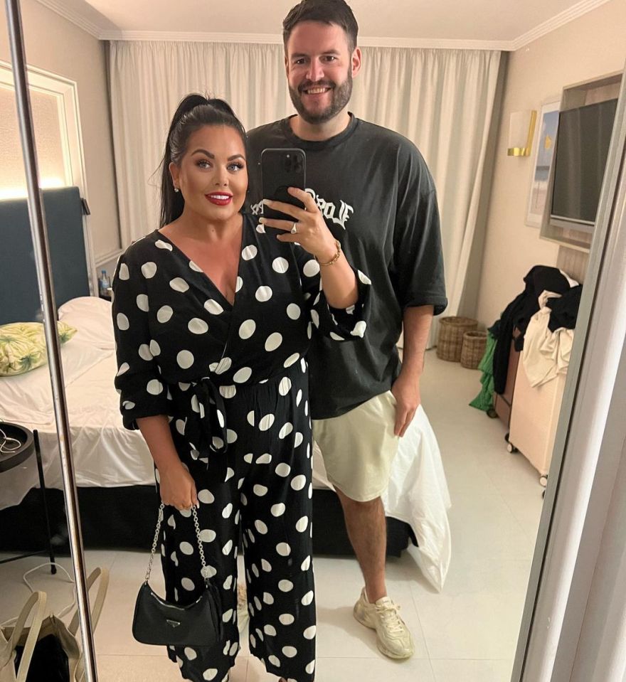 Scarlett Moffatt and a man posing for a selfie.
