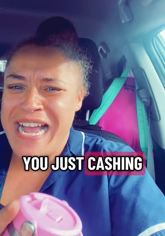 Screenshot of a woman in a car angrily accusing HMRC of robbing her.
