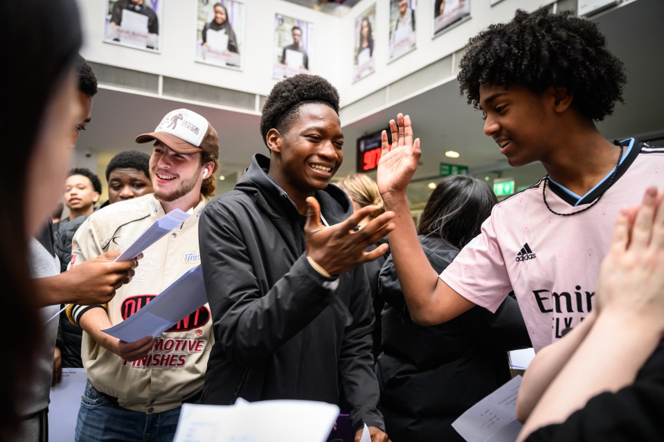 Students react to their GCSE results.