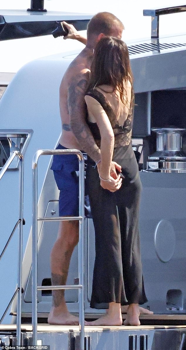 The former footballer, 50, and fashion designer, 51, who have been married for nearly 25 years, packed on the PDA during their latest outing on their £16M superyacht off the Amalfi coast
