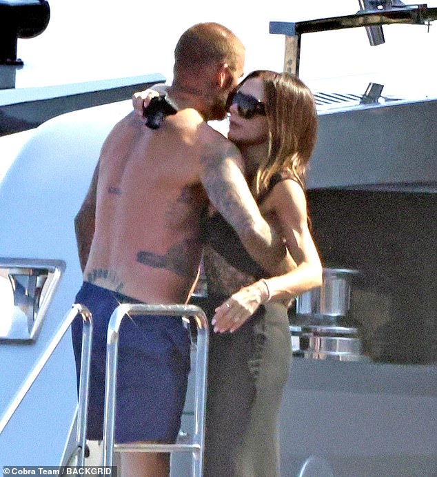 David Beckham was seen squeezing wife Victoria's bottom yet again as they continued their sun-soaked family getaway off the Italian coat on Thursday