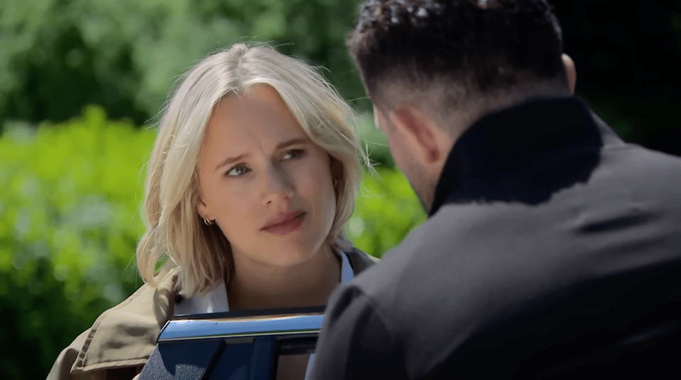 Screenshot of a woman and a man having a conversation.