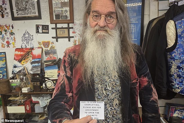 A shopkeeper (pictured) has been left stunned after police told him to change his sign calling shoplifters 'scumbags' because it may be offensive