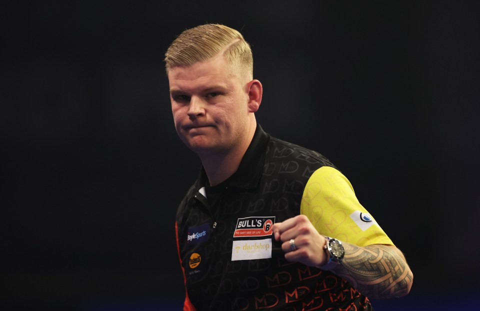 Mike De Decker of Belgium celebrating at a darts semi-final.