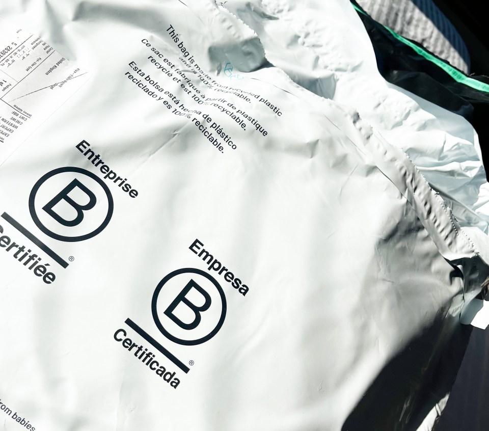 Recycled plastic mailers with certification logos.