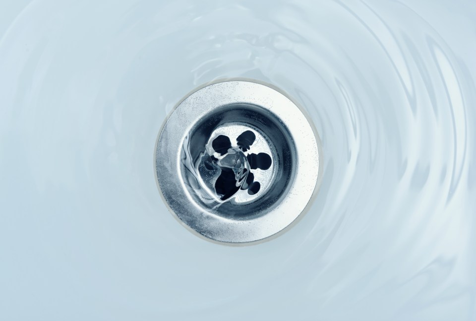 Water draining in a sink.