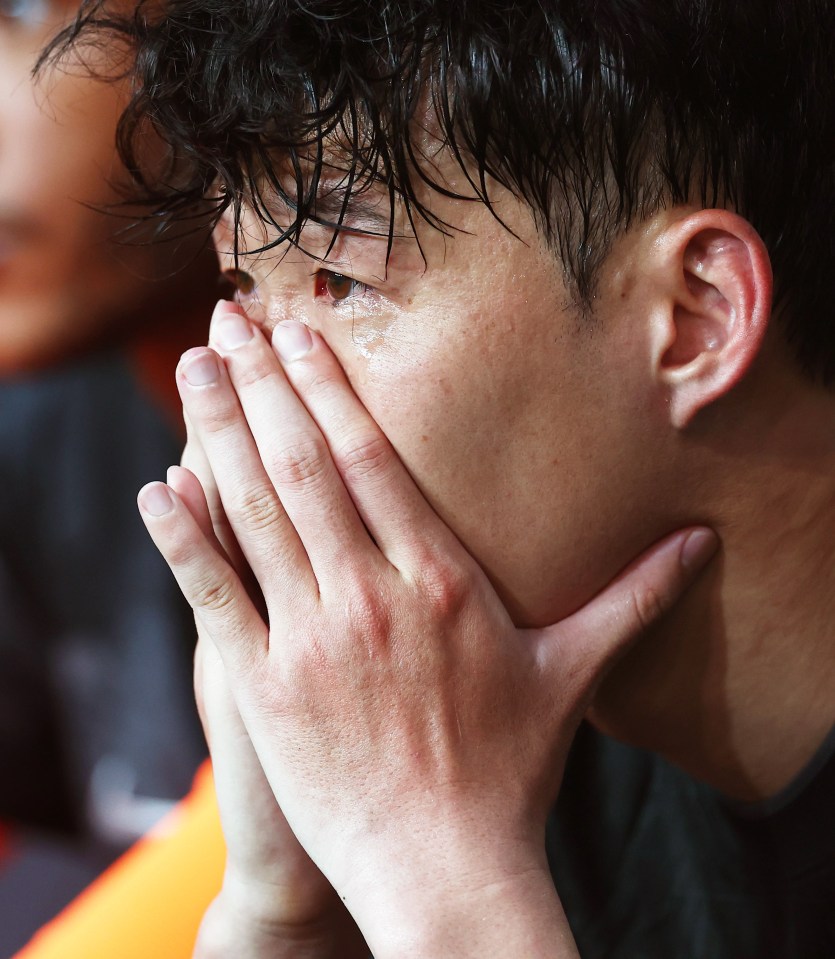Son Heung-Min of Tottenham Hotspur crying on the bench.