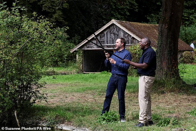 It comes after a brief trip on Friday to Chevening House, the official residence of British foreign secretary David Lammy, set within 3,000 acres of North Downs countryside. Pictured: Mr Lammy and De Vance show off their fishing skills at the Chevening country retreat