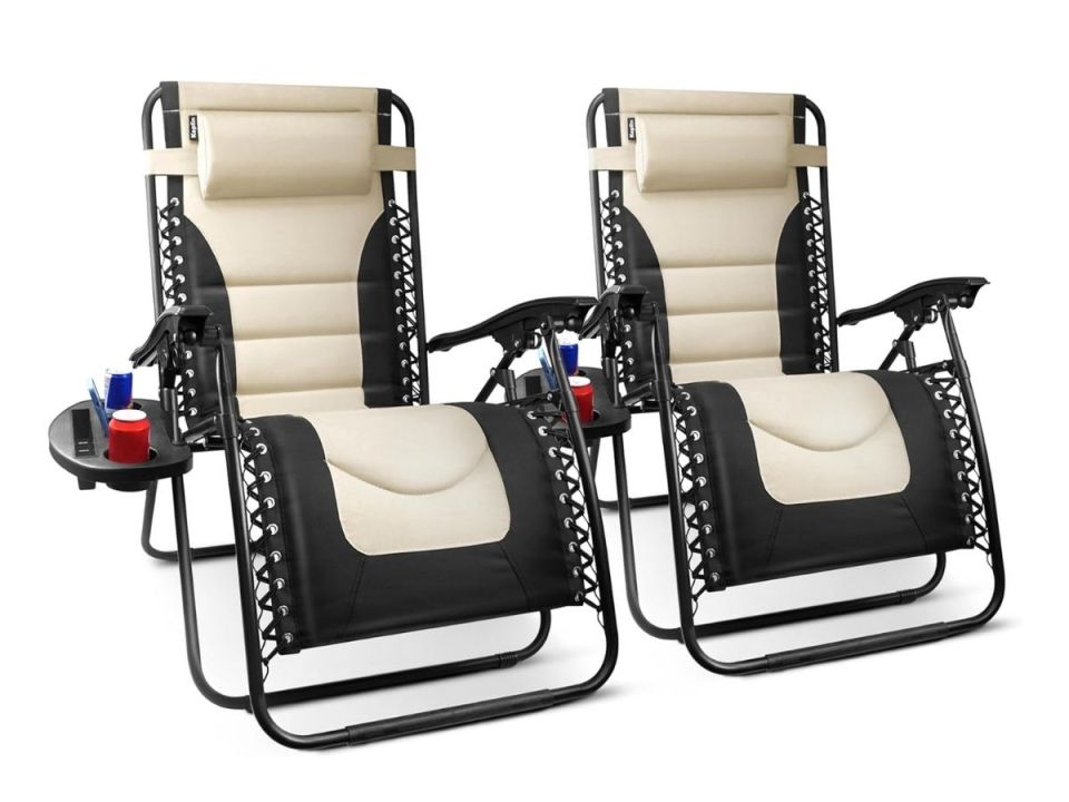 Two zero-gravity chairs with side tables.