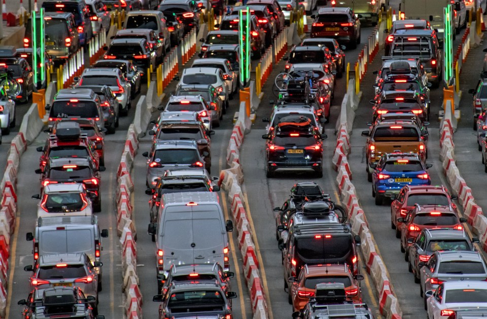 Long lines of cars and vans at a border crossing.