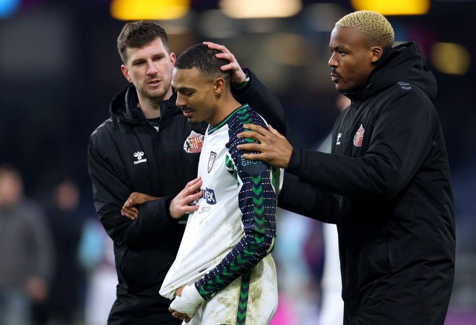 Sunderland's Wilson Isidor consoled by teammates after a match.