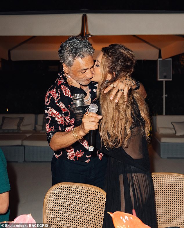 Taika Waititi was on cloud nine as he celebrated his 50th birthday with his wife Rita Ora and a host of celebrity friends in Ibiza on Monday