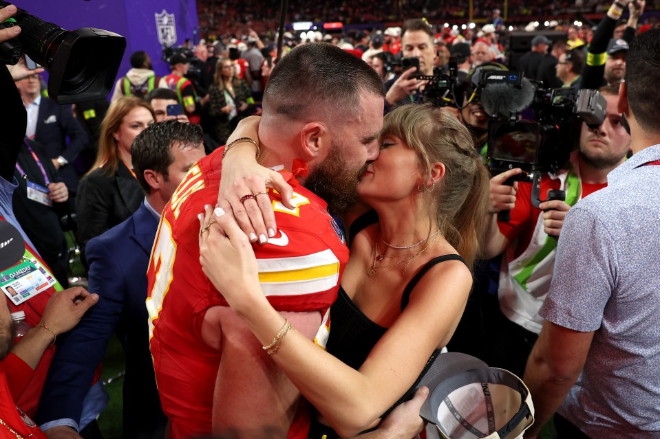 Travis Kelce and Taylor Swift embracing after the Super Bowl.