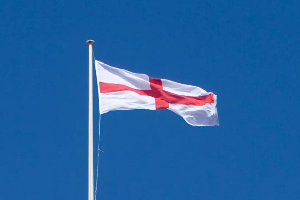An image collage containing 1 images, Image 1 shows St. George's flag flying atop a Liverpool building