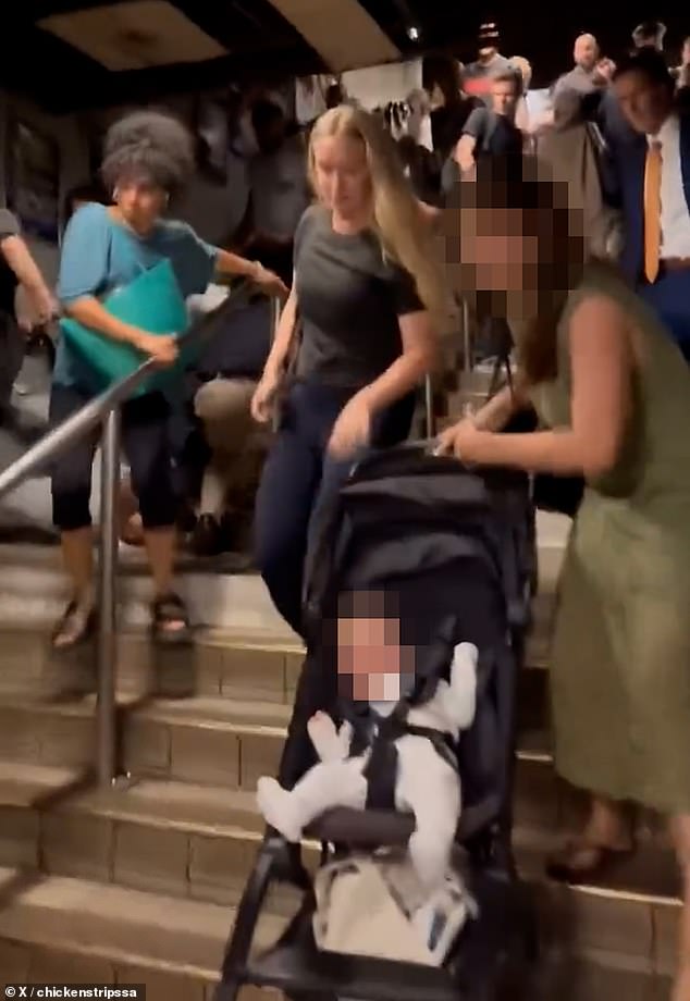 In another incident, on one side of the staircase a baby in a pushchair was crying as their terrified mother screamed