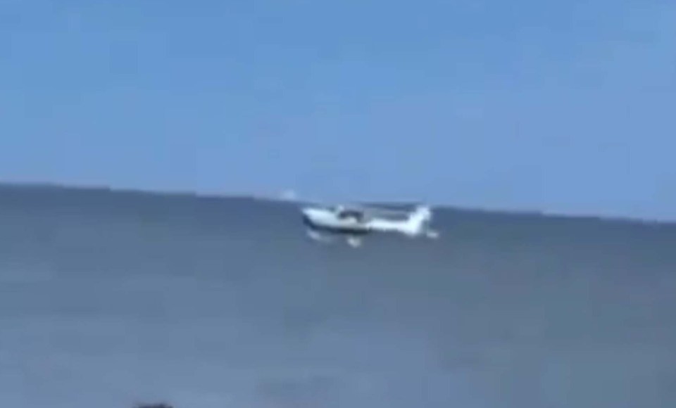 Single-engine plane making an emergency water landing.