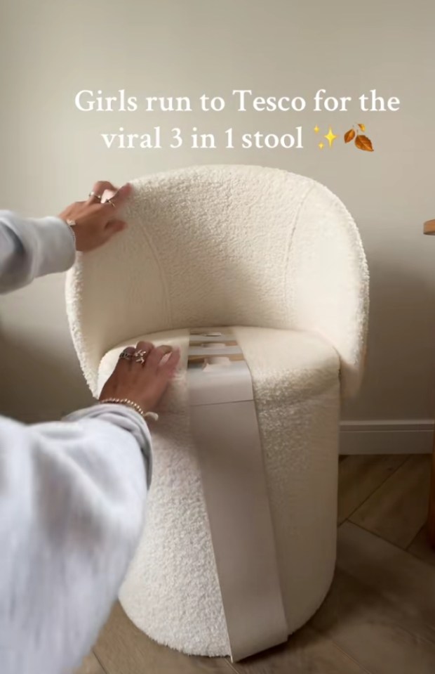 Screenshot of a person unboxing a white 3-in-1 stool from Tesco.