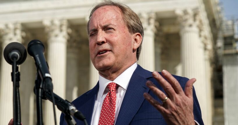 Texas Attorney General Ken Paxton speaks with the media after oral arguments were heard by the United States Supreme Court in Washington, D.C., on Feb. 26, 2024.