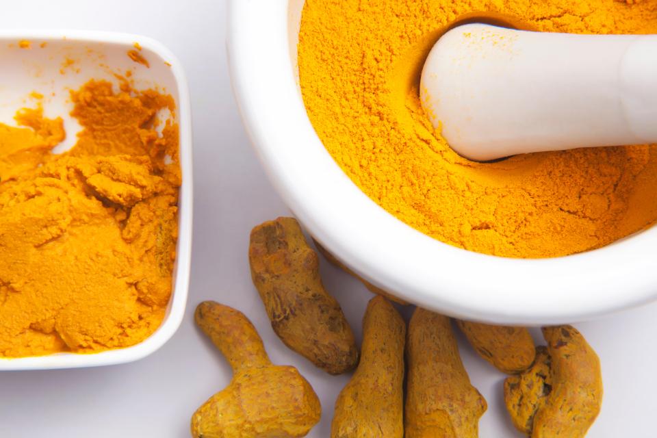 Turmeric powder, paste, and roots.