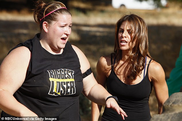 Trainer Jillian Michaels (who did not appear in the Netflix docuseries) is pictured during season nine with contestant Drea