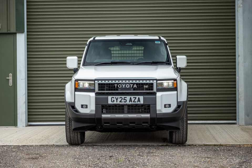 Front view of a white Toyota Hilux.