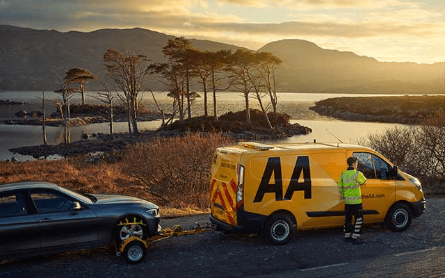 AA roadside assistance towing a car.
