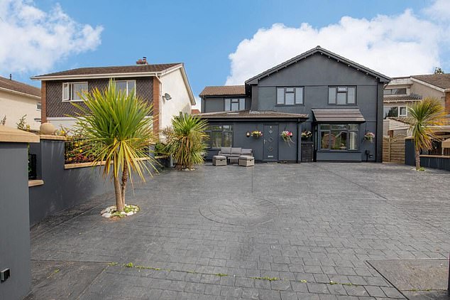 An four-bedroom house has been ruthlessly mocked online after it was listed for £700,000 thanks to its all-grey exterior