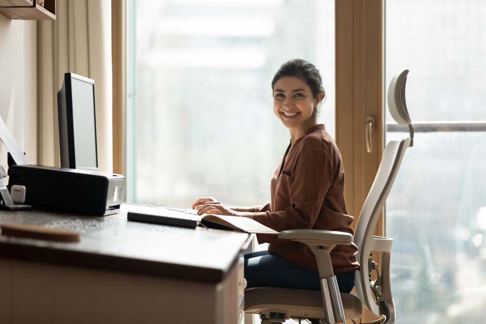 Smiling businesswoman working at her computer.