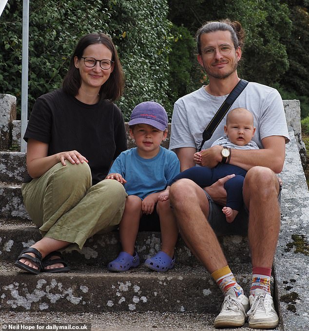 Around 350,000 German tourists visit Cornwall per year to catch a glimpse of the landscape that inspired Rosamunde Pilcher's novels and the hit TV show. Pictured: Riccarda and Felix Griesshammer, 32 and 33, from Nuremberg, with Erich, three, and four-month-old Hedwig