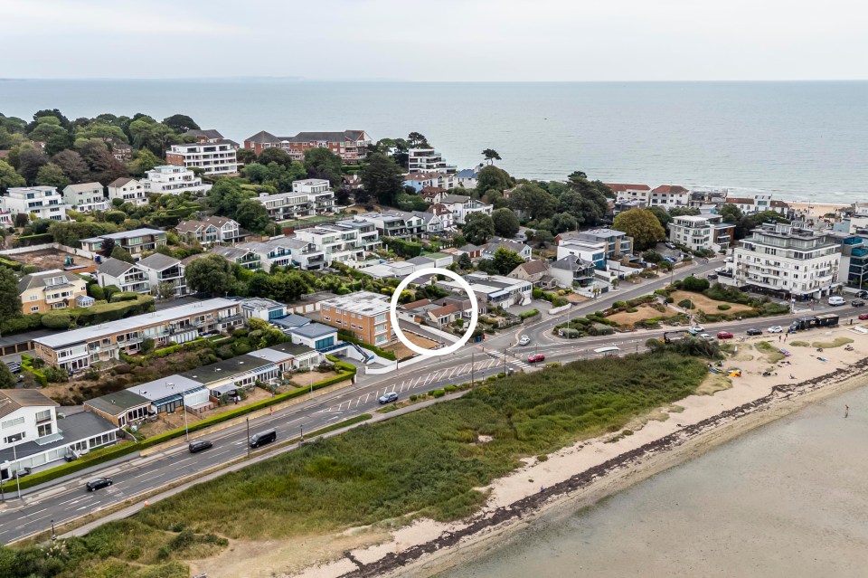Aerial view of a bungalow near the coast, circled for emphasis.