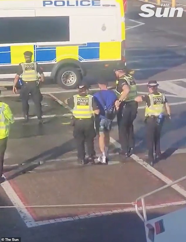 This is the moment Tommy Robinson was arrested at Luton Airport after getting off a flight from Faro, in Portugal. He is now out on bail