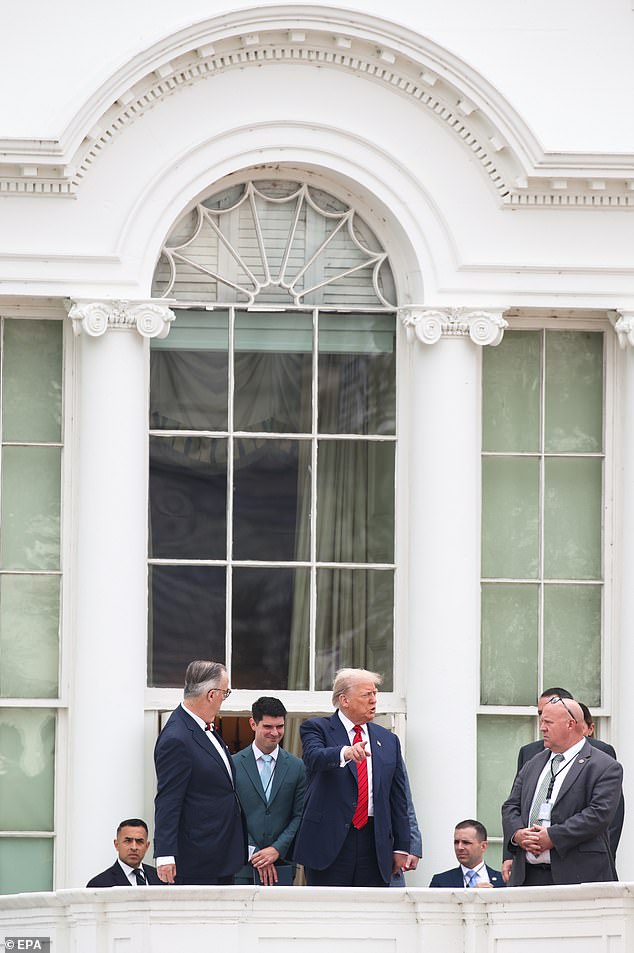President Donald Trump walked from the White House residence onto the one-story rooftop of a portion of the West Wing where the Palm Room and the press briefing room are located