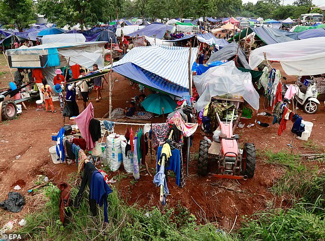 At least 43 people were killed in the intense clashes, which lasted five days and displaced more than 300,000 people on both sides of the border (Pictured: Displaced civilians along the Thai-Cambodian border gather at a makeshift shelter on July 26, 2025)