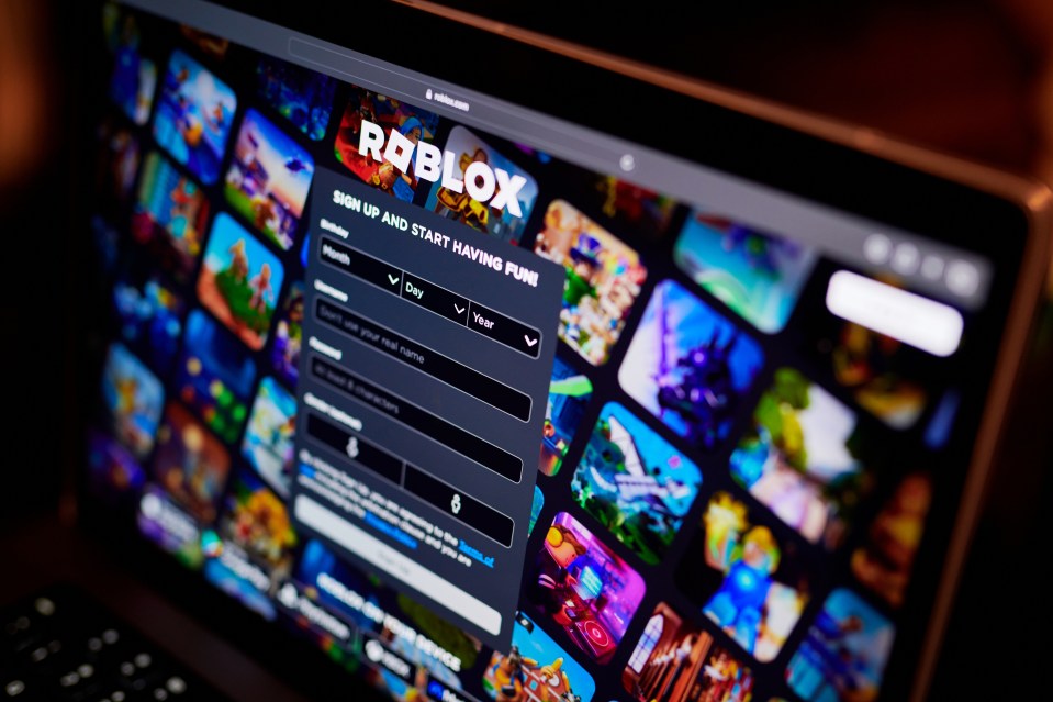Roblox website displayed on a laptop.