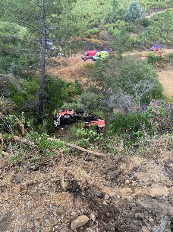 Firetruck accident scene with two fatalities and three serious injuries.