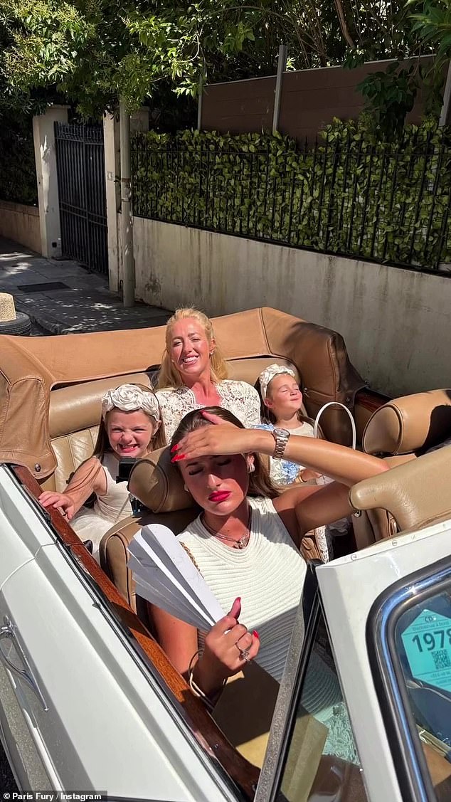 Paris and her daughters arrived to the church in a white vintage car